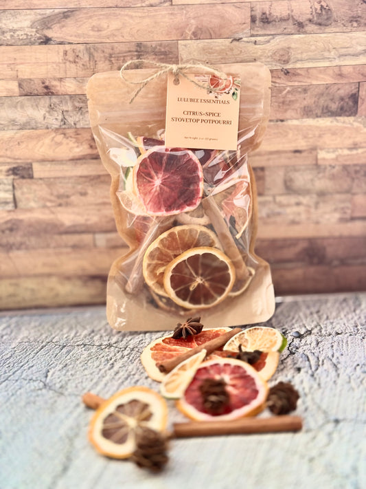 Bag of dried citrus and spice mix with a label on a wooden surface